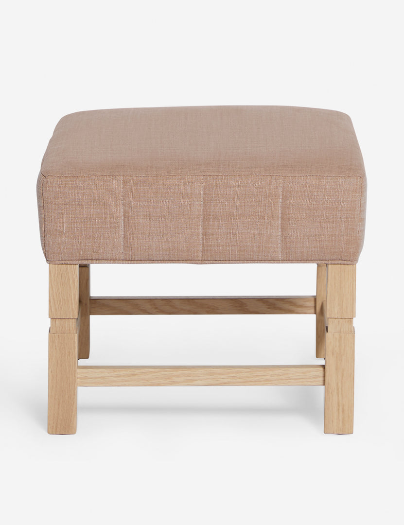 #color::apricot-linen | Ambleside Apricot linen upholstered ottoman by Ginny Macdonald with a carved frame and vertical channeling on the cushion
