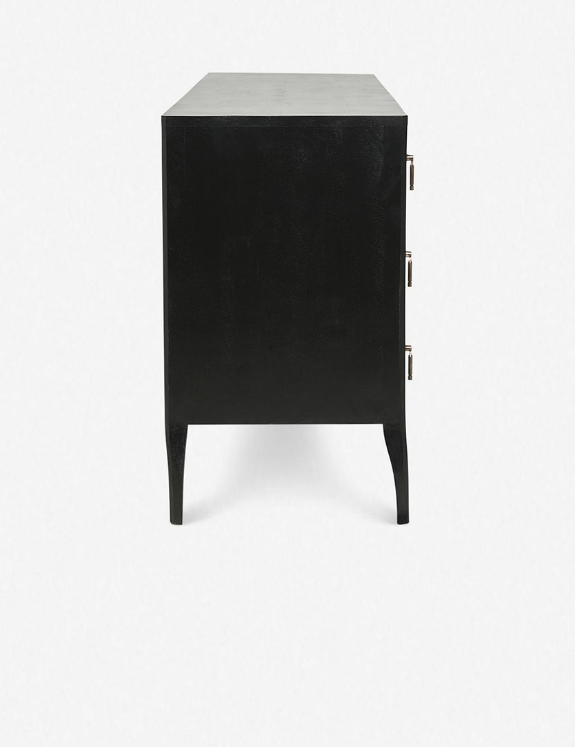 | Side view of the Anabella black wood dresser with silver drawer pulls