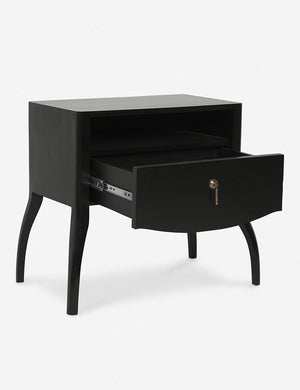 Angled view of the Anabella black wood nightstand with its drawer open