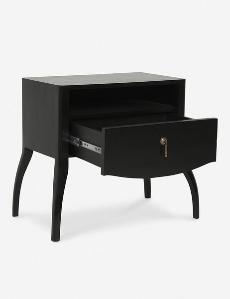 | Angled view of the Anabella black wood nightstand with its drawer open