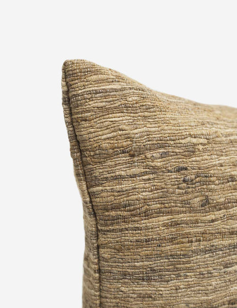 | The corner of the Bryce natural-toned silk square pillow