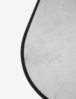 The marble and iron frame on the top of the Ayana Oval Coffee Table