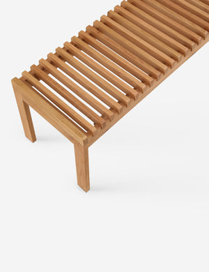 Close up of the Olson mid-century slatted wood bench in natural oak.