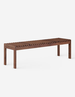 Angled view of the Olson mid-century slatted wood bench in walnut.
