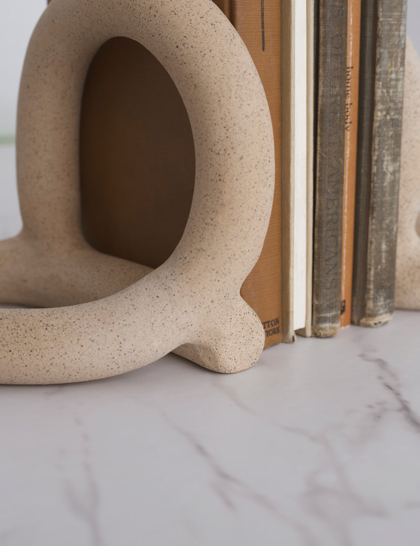 #color::sand | Close-up view of the Bacchus natural speckled ceramic bookends by sin