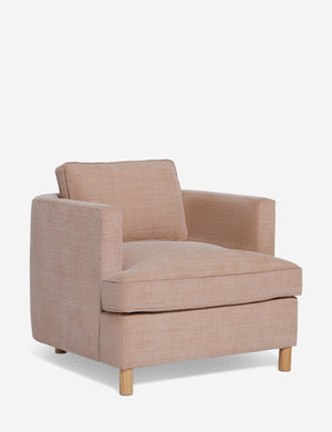 Angled view of the Belmont Apricot linen accent chair