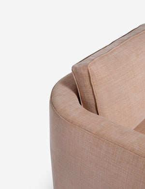 Close-up of the curved back on the Belmont Apricot linen accent chair