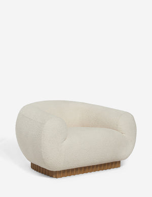 Angled view of the Billow ivory boucle lounge chair