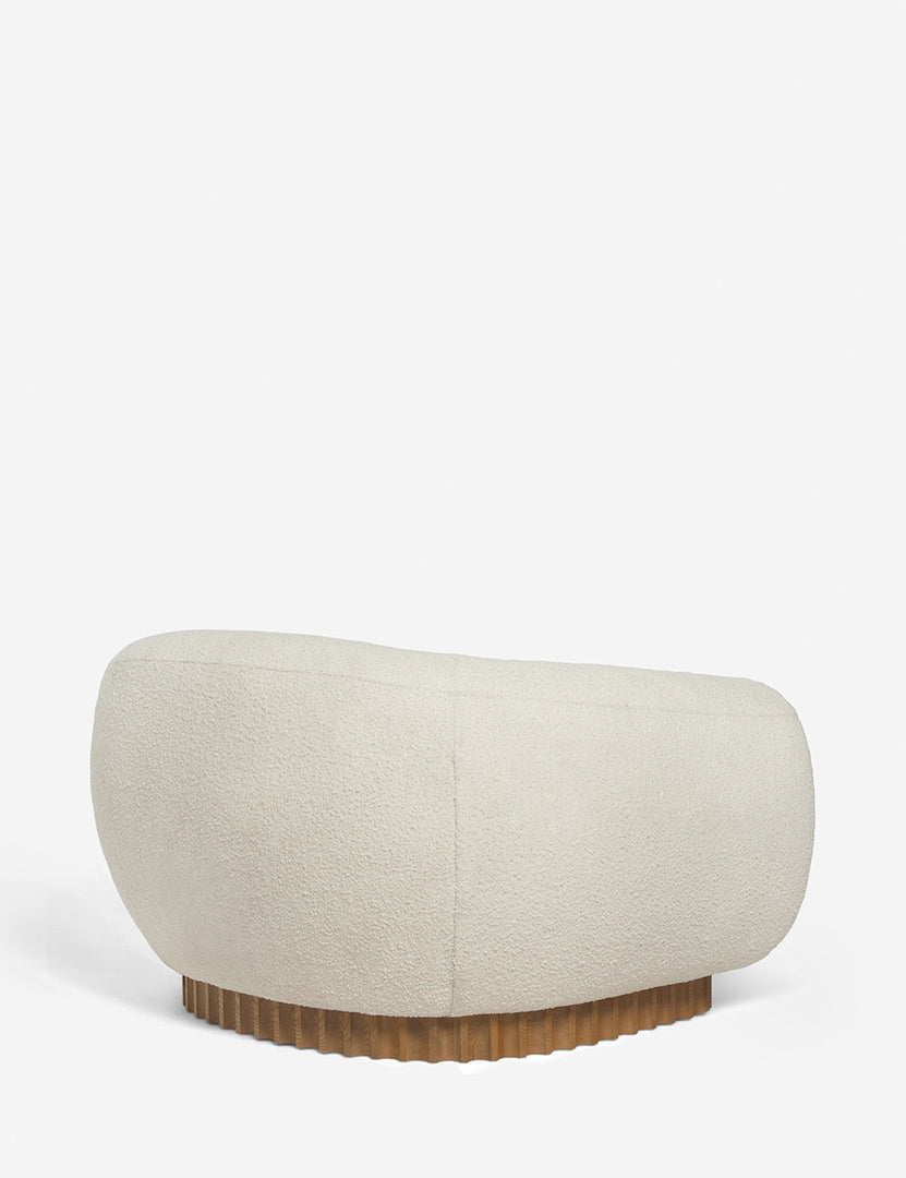 | Angled rear view of the Billow ivory boucle lounge chair 