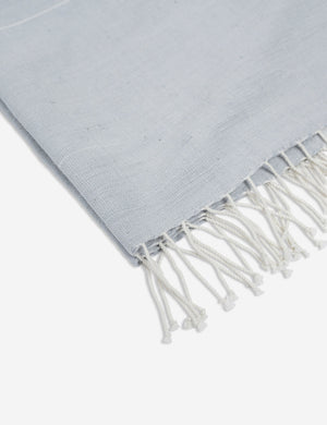 Close-up of the fringed ends on the Melkam light gray Hand Towel by Bolé Road Textiles