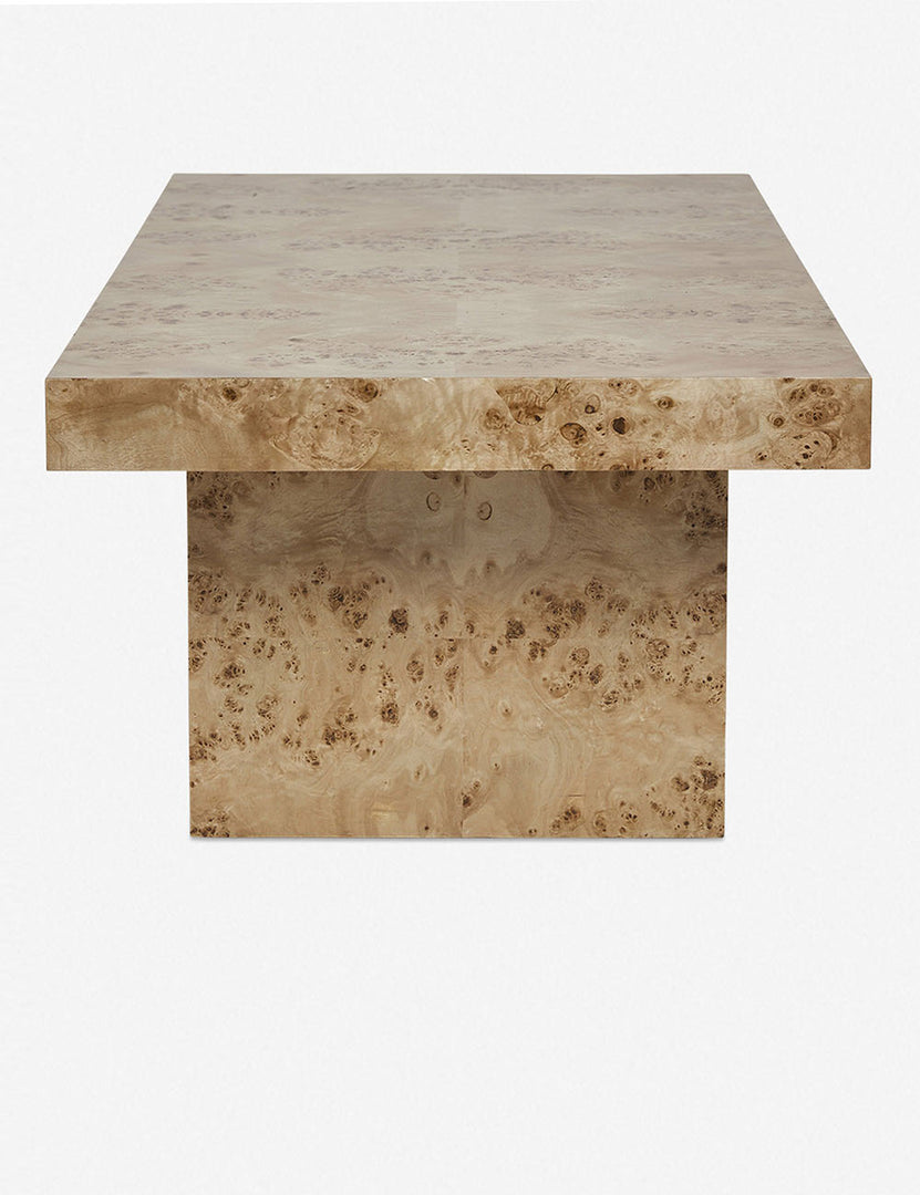 | Side view of the Brisa rectangular burl wood coffee table with four legs