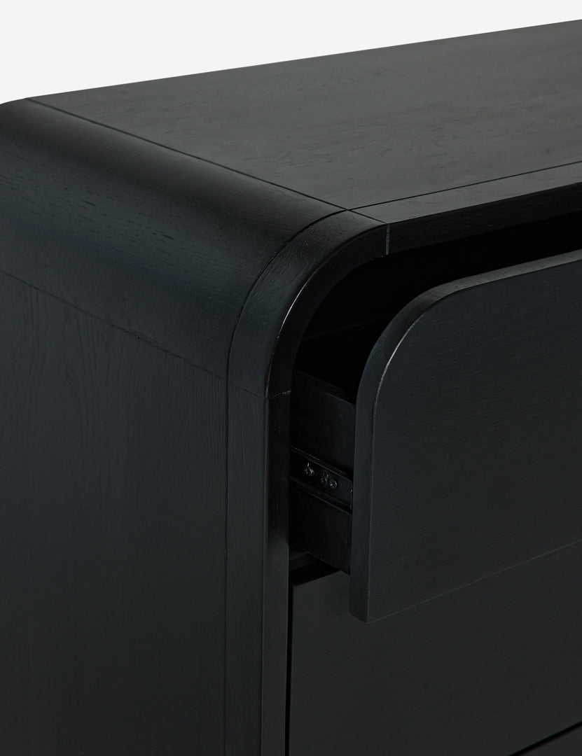 #color::black | Close-up of the rounded corner and drawer glides on the Brooke 3-drawer black oak dresser