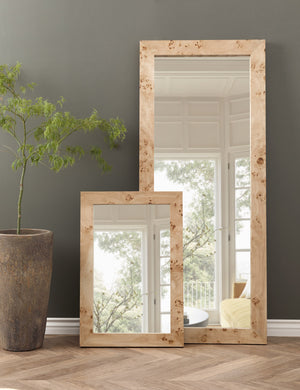 Bree Burl Wood Rectangular Floor Mirror stands against a gray wall with a smaller burl wood mirror