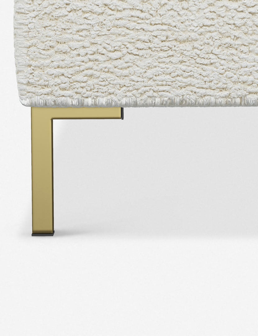 #color::cream-sherpa #size::twin #size::full #size::queen #size::king #size::cal-king | The golden leg on the Deva Cream Sherpa platform bed