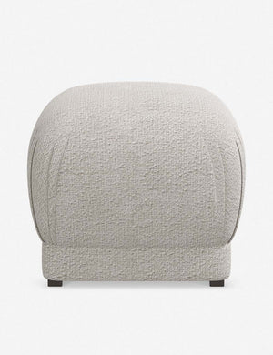 Bailee Moonlight Boucle upholstered ottoman with a pouf-like design and pleated corners
