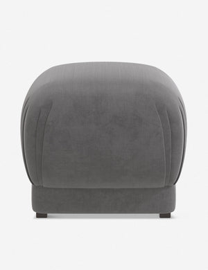 Bailee Steel Velvet upholstered ottoman with a pouf-like design and pleated corners