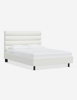Angled view of the Bailee White Boucle platform bed