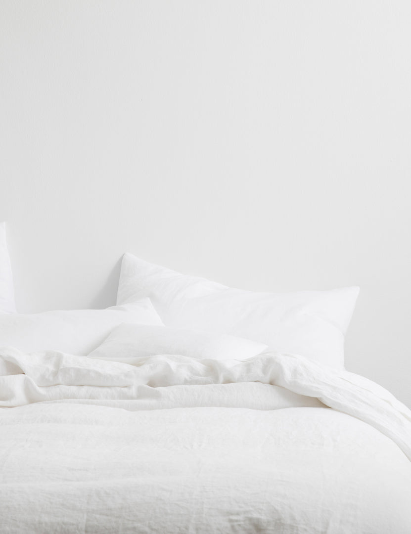 #color::white #size::king #size::queen | The European Flax Linen white Duvet Cover by Cultiver lays on a bed with other cultiver linens