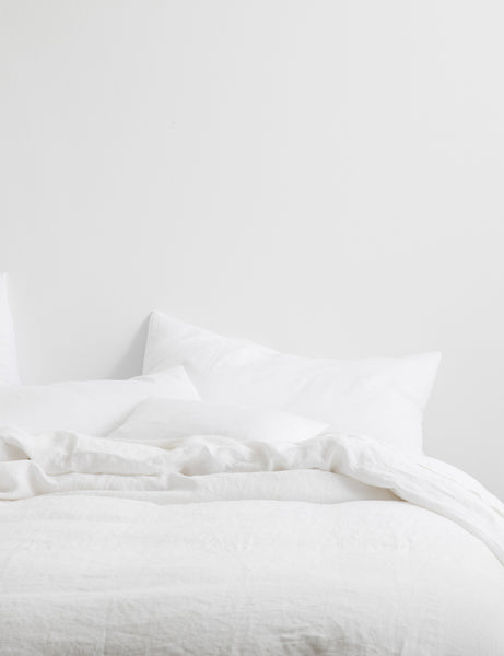 #color::white #size::king #size::queen | The European Flax Linen white Duvet Cover by Cultiver lays on a bed with other cultiver linens
