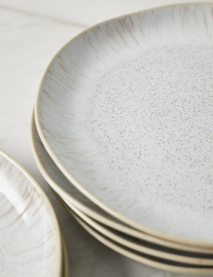 #color::sand | Close-up of the Eivissa set of 6 shiny white glazed speckled stoneware dinner plates by Casafina