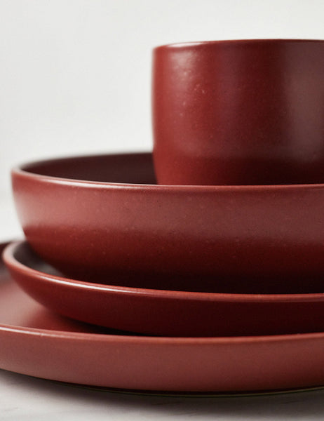 #color::cayenne | Close-up of the Pacifica cayenne red Dinnerware 5-Piece Place Setting by Casafina