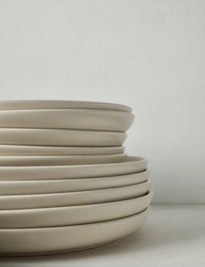 Side view of the plates that are part of the Vanilla-toned Pacifica Dinnerware (18-Piece Set) by Casafina