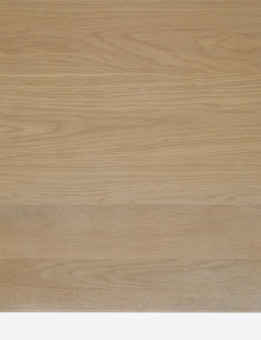 #color::light-oak | Close up view of the wood grain of the Cedro large minimalist light wood coffee table with shelf.