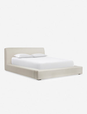 Angled view of the Clayton gray upholstered platform bed