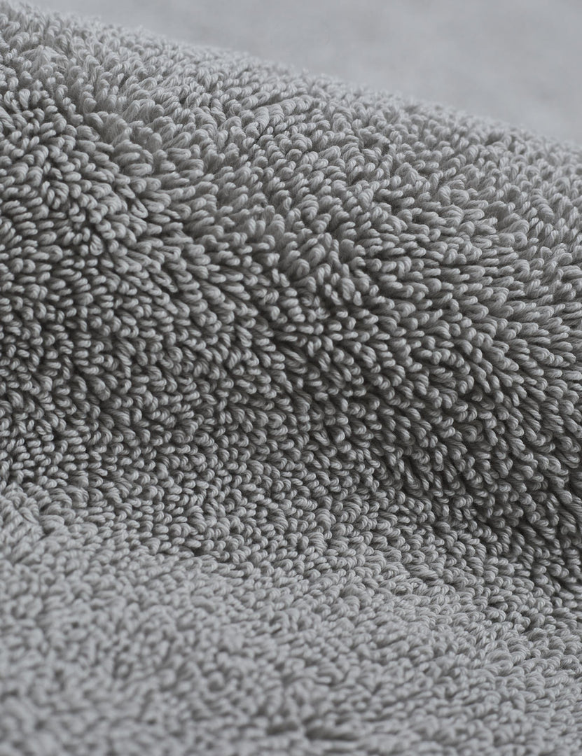 #color::fog | Detailed shot of the Cloud loom sustainable light gray bath mat by coyuchi