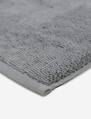 Corner shot of the Cloud loom sustainable slate gray bath mat by coyuchi