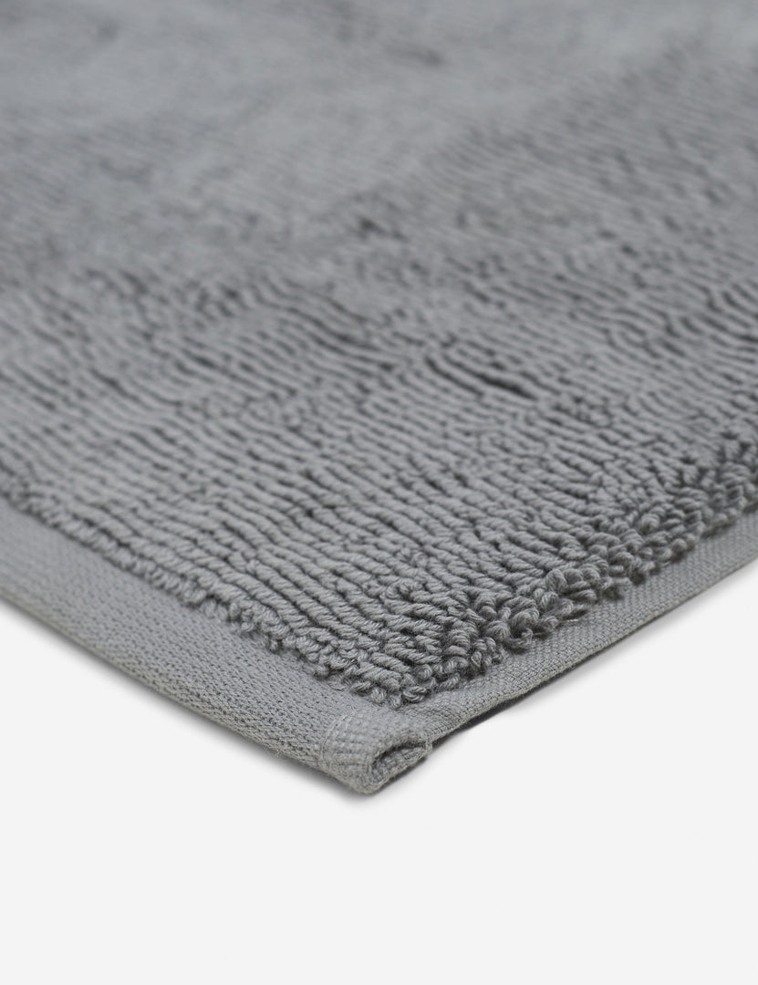 #color::slate | Corner shot of the Cloud loom sustainable slate gray bath mat by coyuchi