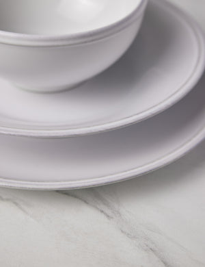Close-up of the grooved edge on the Friso white dinnerware 5-piece place setting by Costa Nova