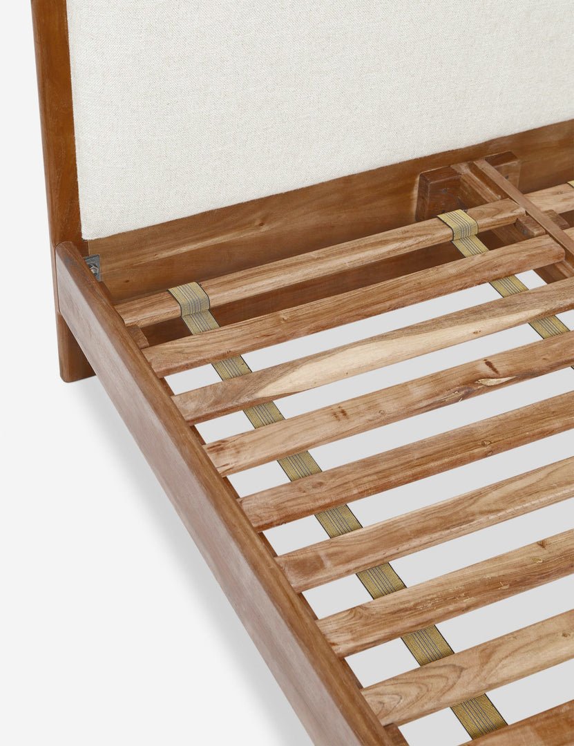 #size::queen #size::king | The wooden support beams on the inside of the Crawford natural linen platform bed