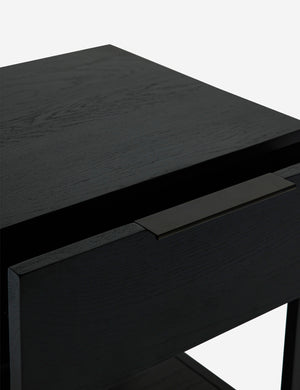 Upper view of the Dana Black Wood Nightstand with its drawer open
