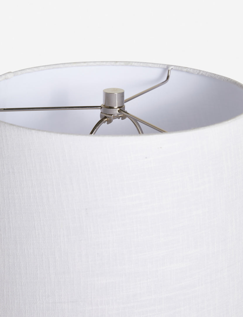 #color::white | The silver hardware and the white linen shade on the top of the Duffy white table lamp 