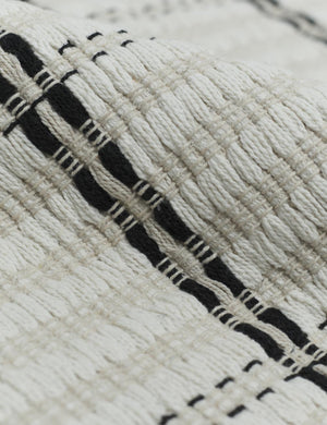 Close up of the cotton material and black and white striped pattern on the Elin Bath Mat