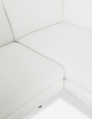 Close-up of the inner corner of the Estee White Linen Sectional Sofa