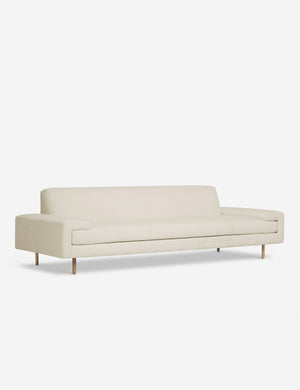 Angled view of the Estee natural linen upholstered sofa