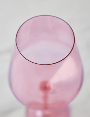 Angled view of a rose pink wine glass by Estelle Colored Glass