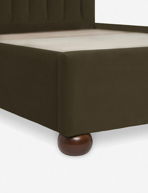 Close up of the corner and round wooden legs of the Balsam Green Evelyn Platform Bed