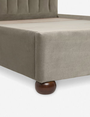 Close up of the corner and round wooden legs of the Oatmeal Neutral Evelyn Platform Bed