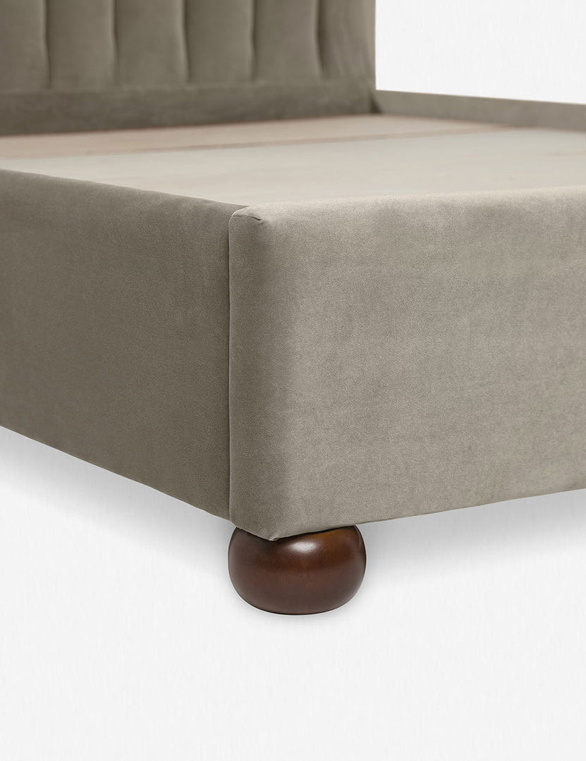 #size::queen #size::king #size::cal-king #color::oatmeal | Close up of the corner and round wooden legs of the Oatmeal Neutral Evelyn Platform Bed