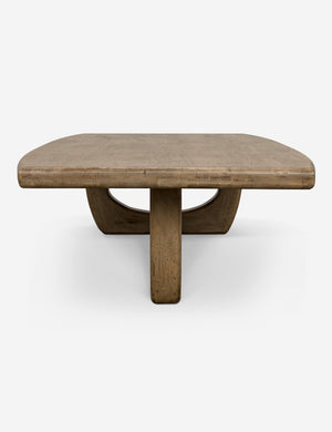 Side view of the Doris walnut coffee table with cutout oval legs