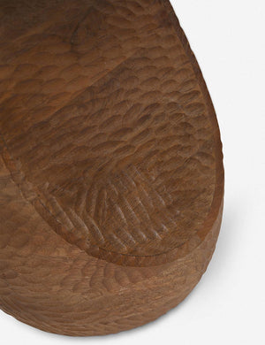 The carved texture on the base of the Gem mango wood side table