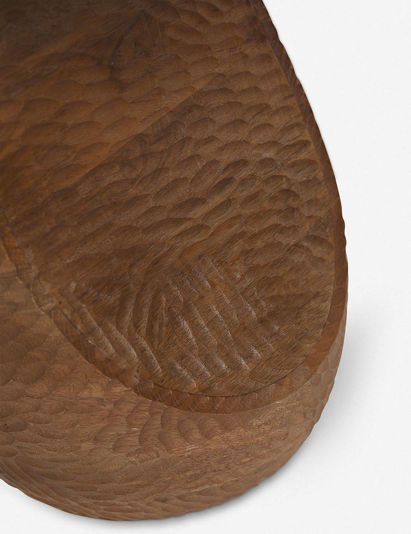 | The carved texture on the base of the Gem mango wood side table
