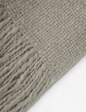Close-up of the wool knit details and tasseled ends on the Goleta gray chunky throw blanket