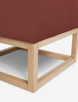 Close up of the airy wooden frame on the bottom of the Grasmere Terracotta Linen Ottoman