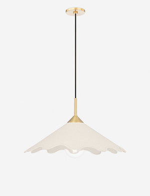 Panya pendant light with a wavy silhouette and antique brass hardware
