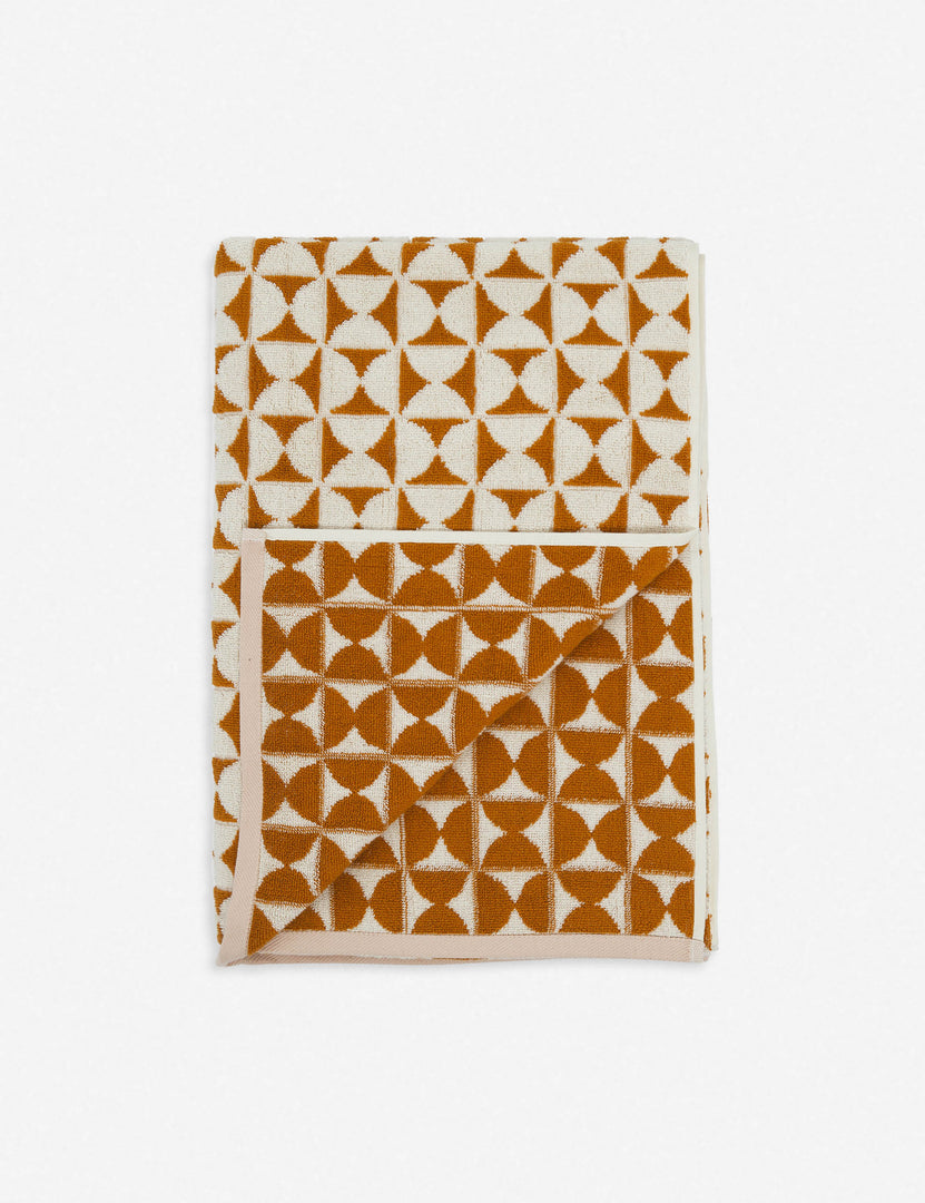 #color::sudan-brown-moon | Harper orange and white towel by house number 23 with half-moon designs