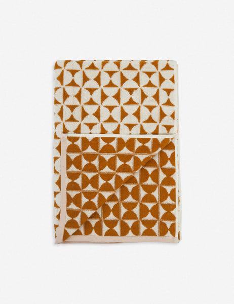 #color::sudan-brown-moon | Harper orange and white towel by house number 23 with half-moon designs